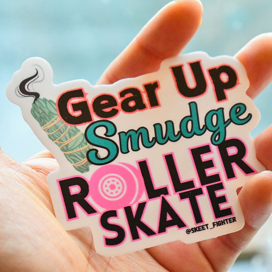 Sticker with 'Gear Up Smudge Roller Skate' text held in a hand against a blurred background