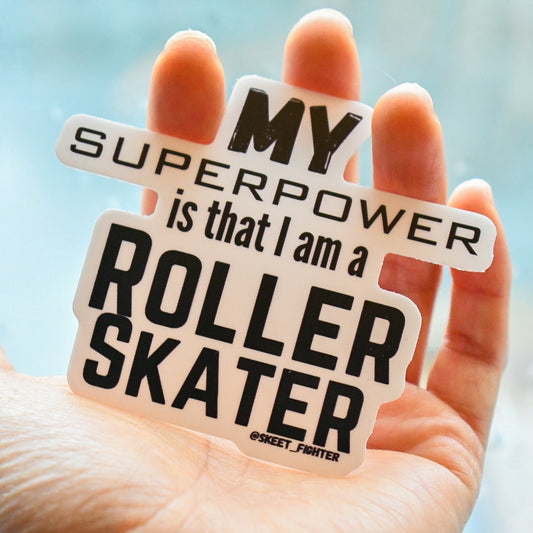 Hand holding a sign with 'My superpower is that I am a roller skater' text.