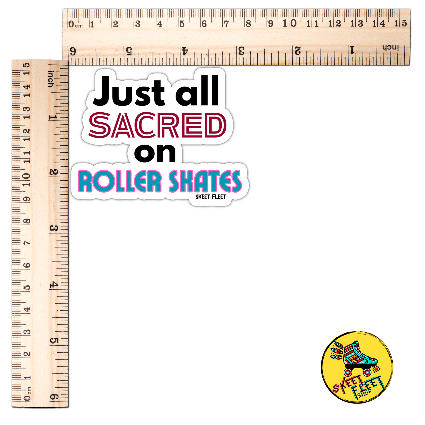 Sticker with text 'Just all sacred on Roller Skates' and a small round sticker with roller skates and text, next to two rulers for scale.
